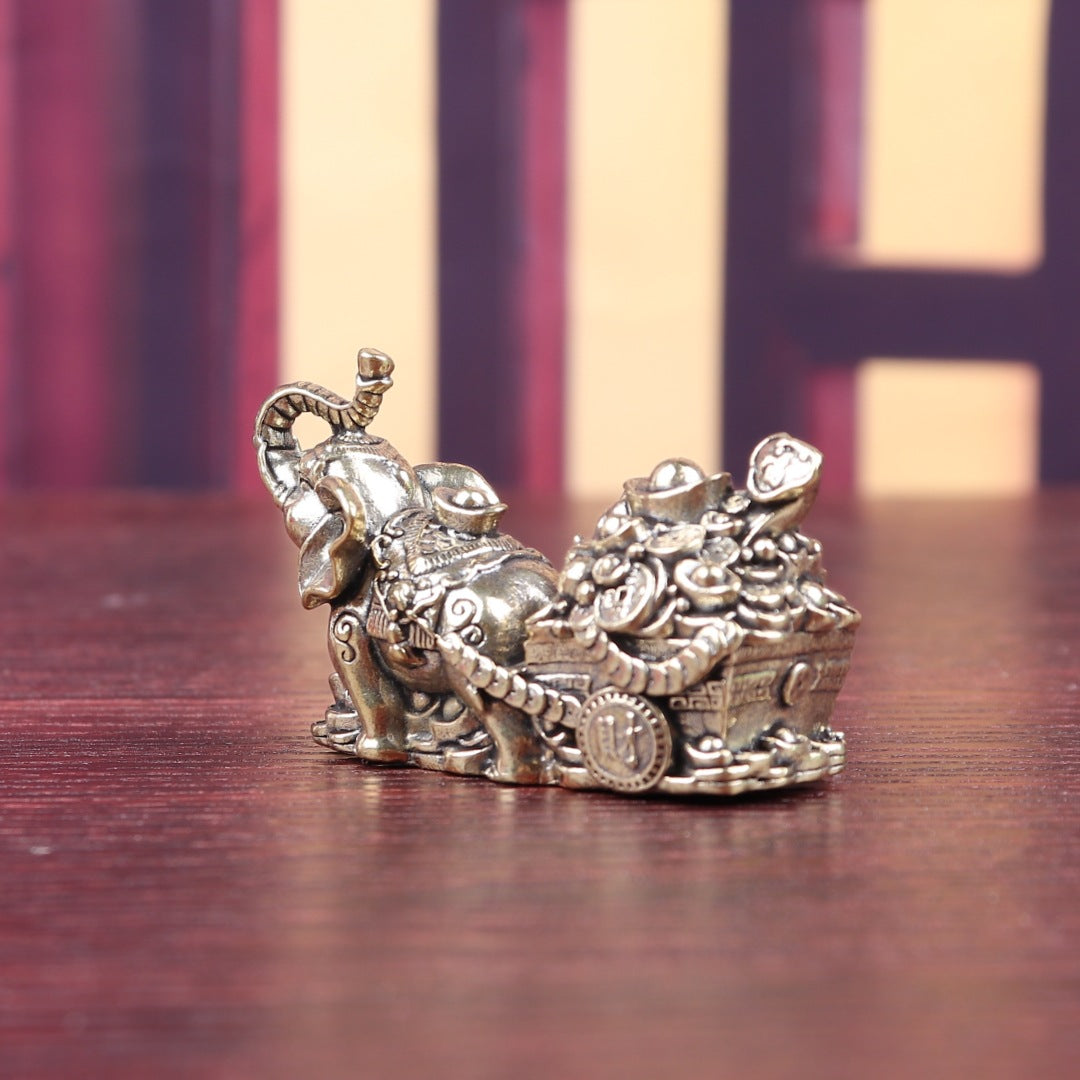 Brass elephant carrying treasure