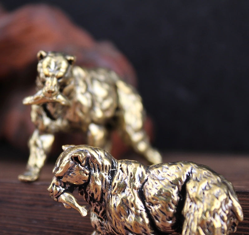 Brass polar bear with fish in its mouth
