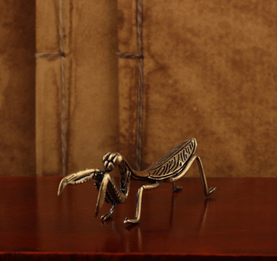Brass praying mantis