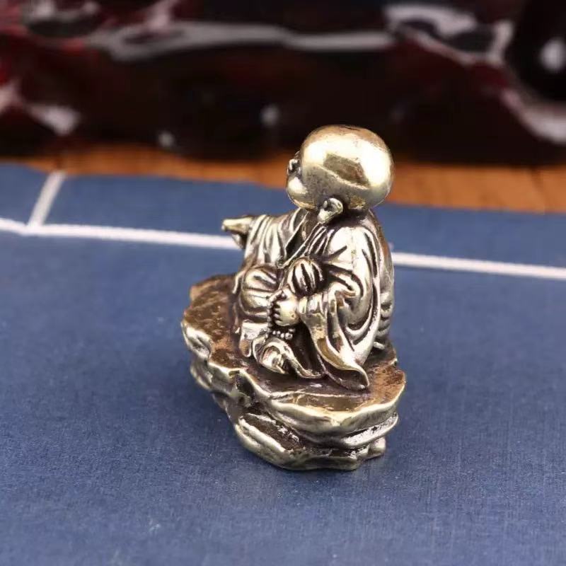 Brass baby monk