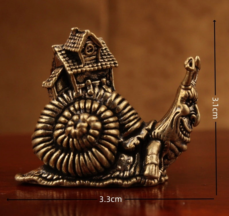 Brass snail carrying house