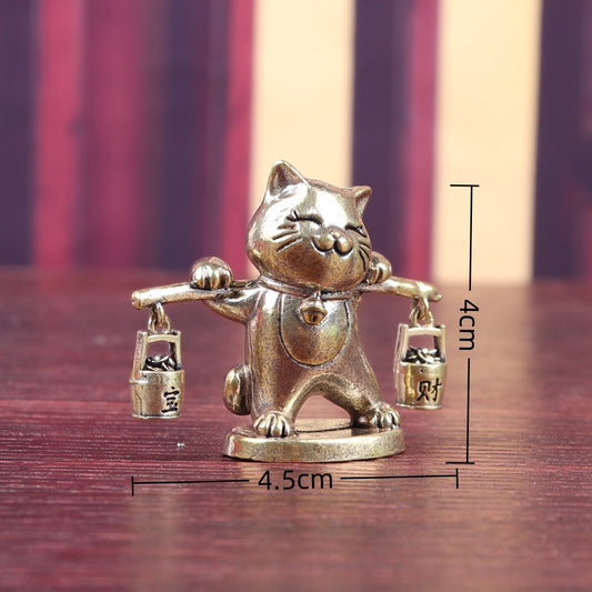 Brass money cat carrying barrels