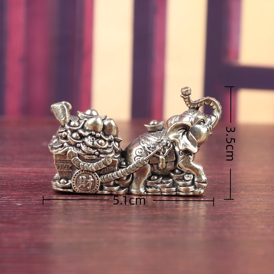 Brass elephant carrying treasure