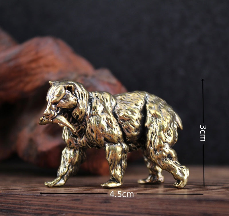 Brass polar bear with fish in its mouth