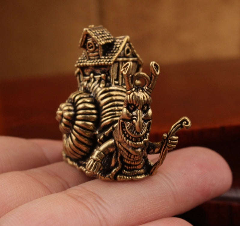 Brass snail carrying house