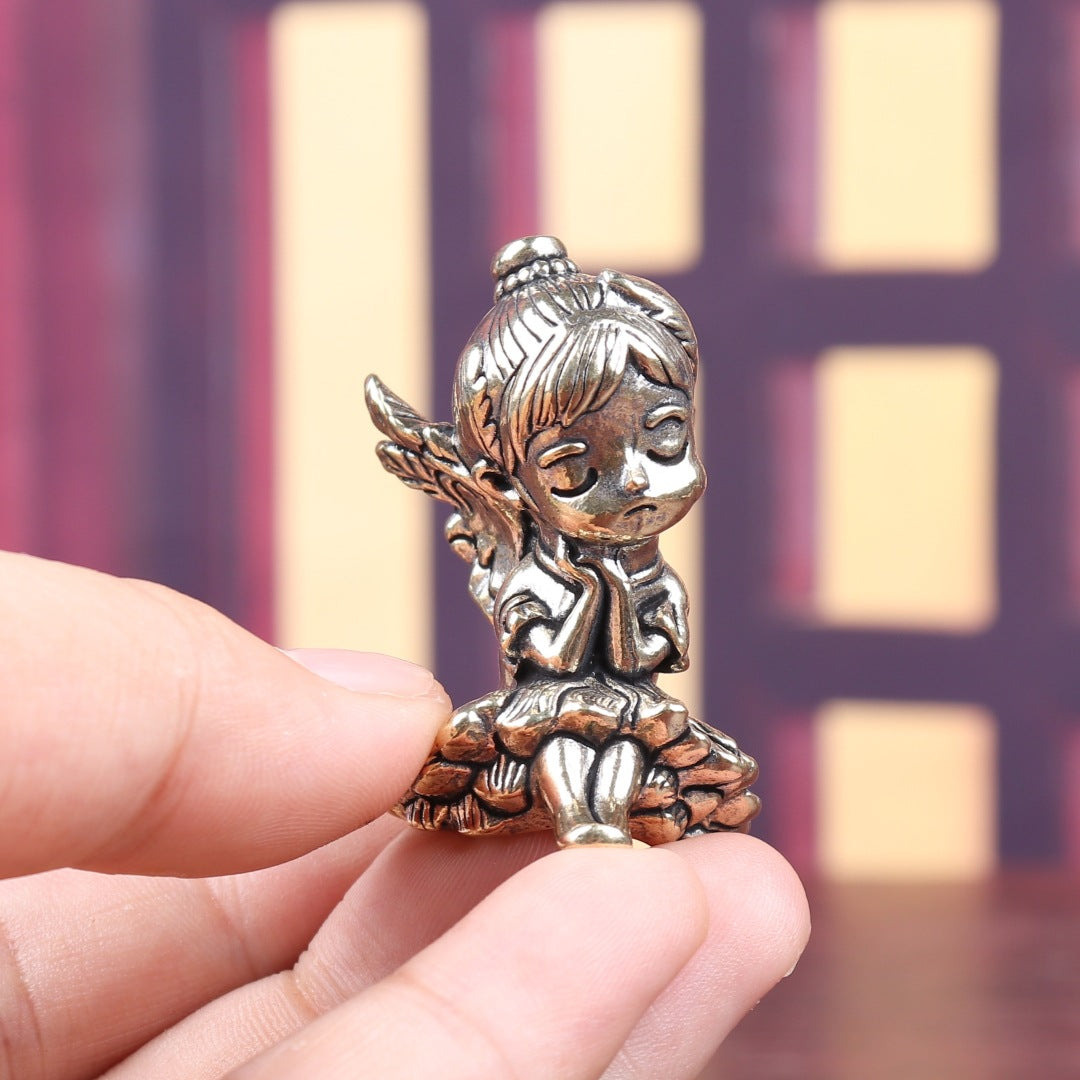 Brass sleeping angel