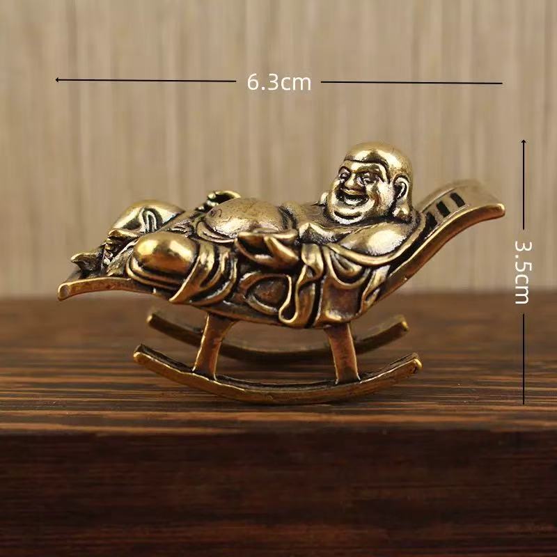 Brass happy Buddha lying on lounge